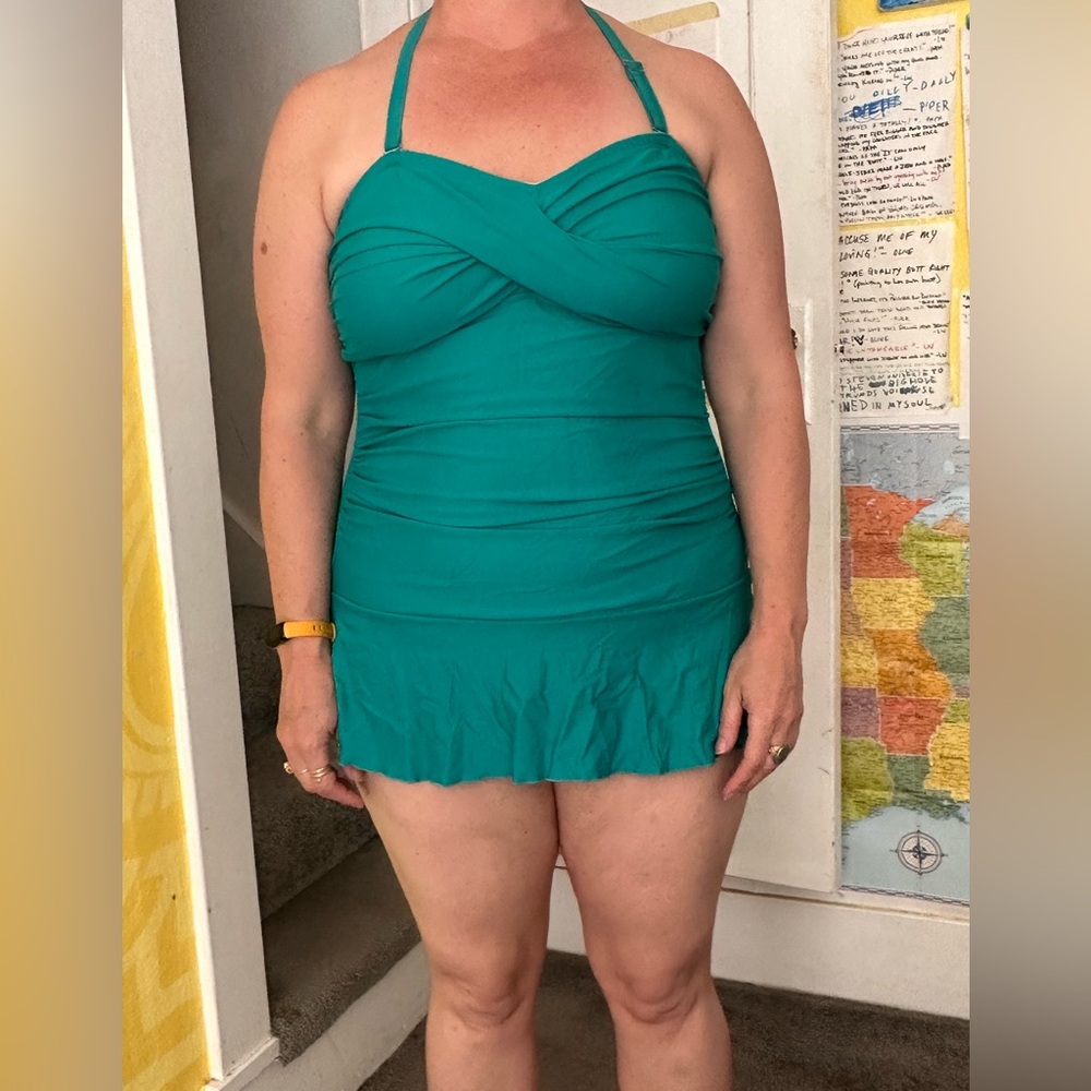 Green one piece swimsuit with attached skirt. Halter strap size XL.